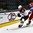 GRAND FORKS, NORTH DAKOTA - APRIL 18: Latvia's Vlads Vulkanovs #13 and Russia's Mikhail Sergachyov #2 battle for the puck during preliminary round action at the 2016 IIHF Ice Hockey U18 World Championship. (Photo by Matt Zambonin/HHOF-IIHF Images)

